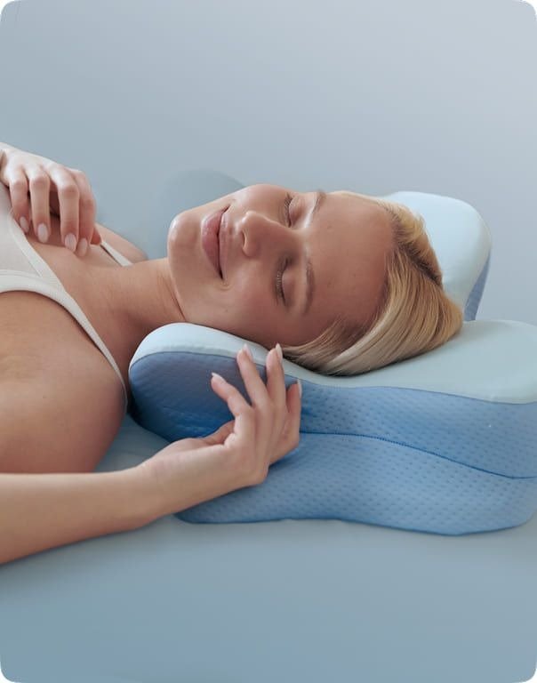 Woman waking up on a pillow